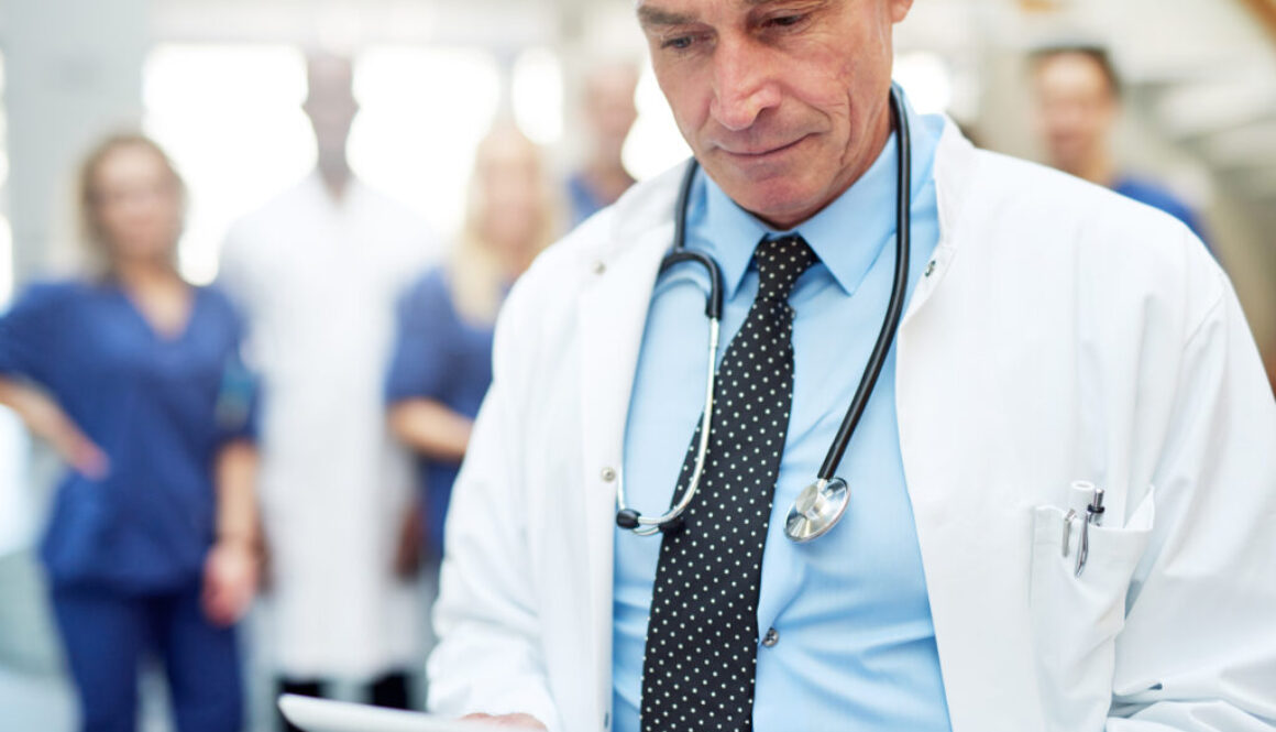 The medicine specialist with tablet in hospital