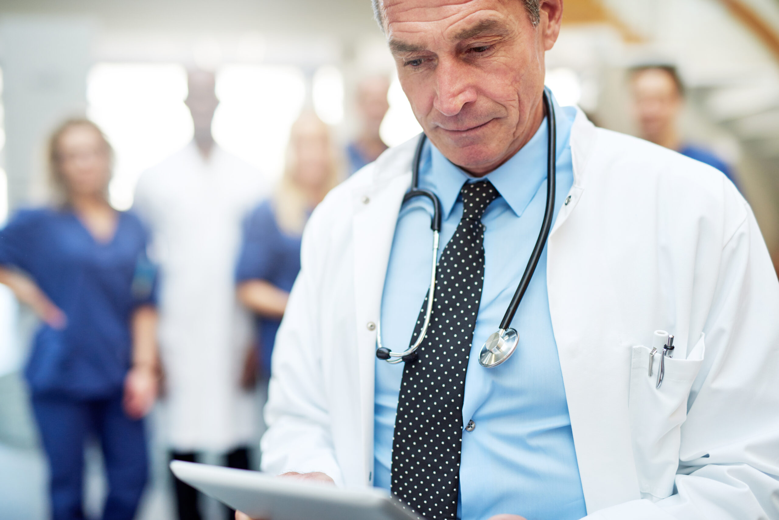 The medicine specialist with tablet in hospital